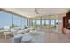 Spacious living room with large windows, comfortable seating, and stunning views at 409 N Point Rd # 501, Osprey, FL 34229