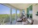 Spacious screened balcony overlooking tranquil water views at 409 N Point Rd # 501, Osprey, FL 34229
