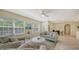 Living room with a sofa and armchairs, near kitchen at 16450 Gloria Ln # 105, Nokomis, FL 34275