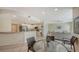 Open kitchen with stainless steel appliances and a breakfast bar at 16450 Gloria Ln # 105, Nokomis, FL 34275
