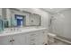 Clean bathroom with double vanity and walk-in shower at 16450 Gloria Ln # 105, Nokomis, FL 34275