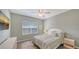 Guest bedroom with a full-size bed and calming decor at 16450 Gloria Ln # 105, Nokomis, FL 34275
