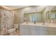 Double vanity bathroom with shower/tub combo at 16450 Gloria Ln # 105, Nokomis, FL 34275