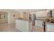 Modern kitchen with stainless steel appliances and granite countertops at 16450 Gloria Ln # 105, Nokomis, FL 34275