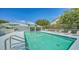 Inviting community pool with covered patio at 16450 Gloria Ln # 105, Nokomis, FL 34275