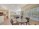 Open concept kitchen and dining area with stainless steel appliances and breakfast bar at 16450 Gloria Ln # 105, Nokomis, FL 34275