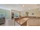 Modern kitchen with stainless steel appliances and a breakfast bar at 16450 Gloria Ln # 105, Nokomis, FL 34275
