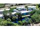 Aerial view of building near pond and road at 16450 Gloria Ln # 105, Nokomis, FL 34275