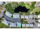 Aerial view showcasing community and pond at 16450 Gloria Ln # 105, Nokomis, FL 34275