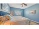 Bright bedroom with a king-size bed and coastal decor at 16450 Gloria Ln # 105, Nokomis, FL 34275