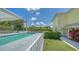 Community pool with adjacent building and landscaping at 16450 Gloria Ln # 105, Nokomis, FL 34275