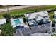 Aerial view showing building, pool, and parking at 16450 Gloria Ln # 105, Nokomis, FL 34275