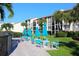 Outdoor patio furniture with umbrellas near condominium building at 6236 Midnight Pass Rd # 304, Sarasota, FL 34242