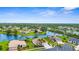 Gorgeous waterfront community featuring manicured lawns, serene lake views, and luxurious single-Gathering homes at 310 Lake Tahoe Ct, Englewood, FL 34223