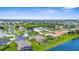 Beautiful lakefront homes nestled in a vibrant community with well-maintained landscaping and ample green spaces at 310 Lake Tahoe Ct, Englewood, FL 34223