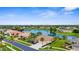 Beautiful aerial view showcasing waterfront properties, lush greenery, and a serene residential neighborhood at 310 Lake Tahoe Ct, Englewood, FL 34223