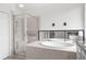 Elegant bathroom features a luxurious soaking tub and separate glass shower at 310 Lake Tahoe Ct, Englewood, FL 34223