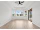 Spacious bedroom with tray ceiling, large windows, and sliding glass door to pool area at 310 Lake Tahoe Ct, Englewood, FL 34223