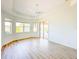 Bright bedroom offering ample natural light and direct access to the outdoor lanai and pool area at 310 Lake Tahoe Ct, Englewood, FL 34223