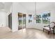 Light-filled dining area with large windows overlooks the serene outdoor space at 310 Lake Tahoe Ct, Englewood, FL 34223