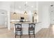 Bright kitchen features a breakfast bar with granite counters and modern stainless steel appliances at 310 Lake Tahoe Ct, Englewood, FL 34223