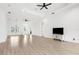 Bright, expansive living room with hardwood floors, recessed lighting, and a cozy atmosphere perfect for relaxation at 310 Lake Tahoe Ct, Englewood, FL 34223