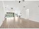 Spacious living room with an open floor plan, hardwood floors, and natural light, great for entertaining at 310 Lake Tahoe Ct, Englewood, FL 34223