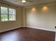 Spacious bedroom with wood-look floors and large window at 2320 Terra Ceia Bay Blvd # 203, Palmetto, FL 34221