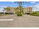 Condo building with parking and lush landscaping at 2320 Terra Ceia Bay Blvd # 203, Palmetto, FL 34221