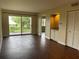 Bright living room with wood-look floors, sliding glass doors to balcony, and wet bar at 2320 Terra Ceia Bay Blvd # 203, Palmetto, FL 34221