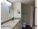 Bathroom with granite countertop double vanity and shower at 2320 Terra Ceia Bay Blvd # 203, Palmetto, FL 34221