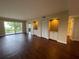 Open living room with wood-look floors and wet bar at 2320 Terra Ceia Bay Blvd # 203, Palmetto, FL 34221