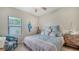 Bedroom with a full-size bed and stylish decor at 308 Cassano Dr, Nokomis, FL 34275