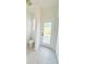 Small bathroom with toilet and door to the pool area at 310 Lake Tahoe Ct, Englewood, FL 34223