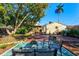 Picturesque backyard featuring comfortable seating and mature trees, perfect for relaxing and entertaining at 1810 28Th W St, Bradenton, FL 34205