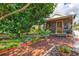 Backyard patio features a wooden deck and beautiful landscaping at 1810 28Th W St, Bradenton, FL 34205