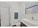 Bright bathroom with a frameless glass shower, modern vessel sink, and window for natural light at 1810 28Th W St, Bradenton, FL 34205