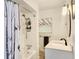 Bright bathroom with a new vanity, updated fixtures, shower and tub featuring a stylish shower curtain at 1810 28Th W St, Bradenton, FL 34205