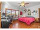 Bright bedroom featuring hardwood floors, desk and a large window with views at 1810 28Th W St, Bradenton, FL 34205