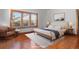 Serene bedroom with hardwood floors, natural light, and neutral decor offering a relaxing retreat at 1810 28Th W St, Bradenton, FL 34205