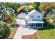 Charming home with guest cottage, featuring a metal roof and well-maintained landscaping at 1810 28Th W St, Bradenton, FL 34205