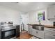Bright kitchen with stainless steel appliances, butcher block countertops and white shaker cabinets at 1810 28Th W St, Bradenton, FL 34205