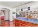 Open layout joining kitchen, dining, and living rooms featuring hardwood floors and lots of natural light at 1810 28Th W St, Bradenton, FL 34205