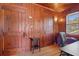 Charming office featuring wood-paneled walls, wooden doors and hardwood flooring at 1810 28Th W St, Bradenton, FL 34205