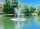 Picturesque pond featuring a fountain and landscaping at 4208 Central Sarasota Pkwy # 1412, Sarasota, FL 34238