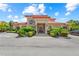 Attractive building exterior with landscaping at 7718 Lake Vista Ct # 405, Lakewood Ranch, FL 34202