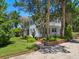 Two-story home with lush landscaping and brick accents at 4521 Bay Shore Rd, Sarasota, FL 34234