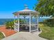 Quaint waterfront gazebo with seating area at 4521 Bay Shore Rd, Sarasota, FL 34234