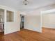 Living room with hardwood floors and built-in shelving at 4521 Bay Shore Rd, Sarasota, FL 34234