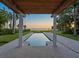 Rectangular pool with pergola and waterfront view at 4521 Bay Shore Rd, Sarasota, FL 34234